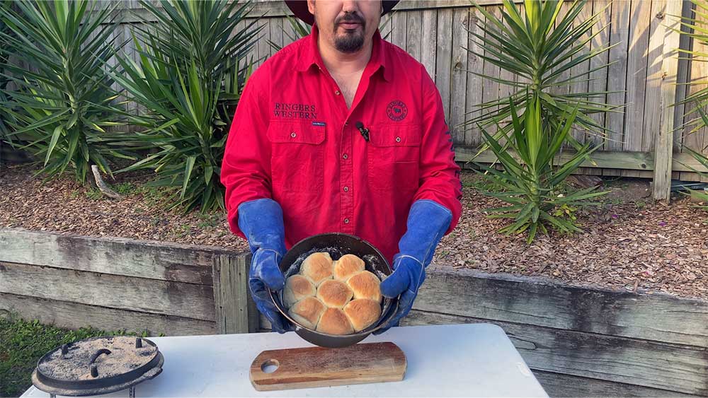 mick holding camp oven bread rolls